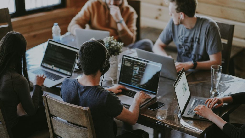 SEO company in Dhanmondi – team planning an SEO strategy on laptops