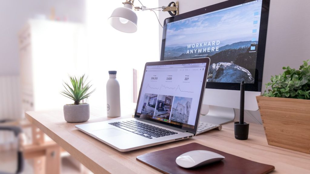 Why is my website not showing on Google – website owner checking a site on a laptop